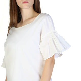 White blouse with ruffled sleeves.