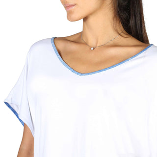 White v-neck top with blue trim.