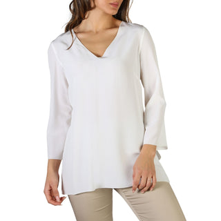 Woman’s white V-neck blouse.