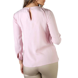 Light pink long-sleeved blouse.