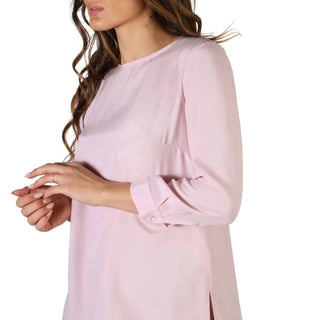 Light pink long-sleeved blouse.