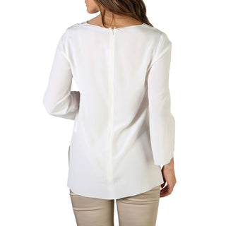 White long-sleeved blouse.