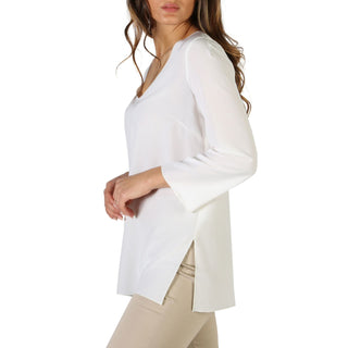 White long-sleeved blouse.