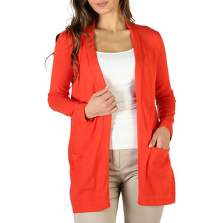 Woman’s orange cardigan.