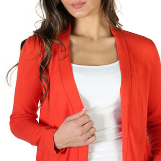 Woman’s red cardigan.