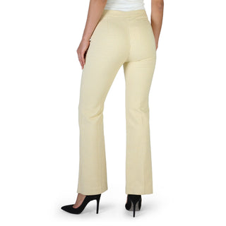 Woman’s patterned yellow pants.