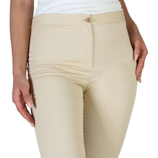 Beige fitted trousers.